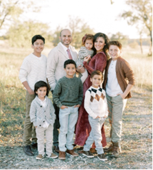 A picture of David with his wife and children