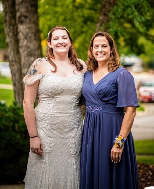 Photo of Anna Greer with her daughter on her wedding day