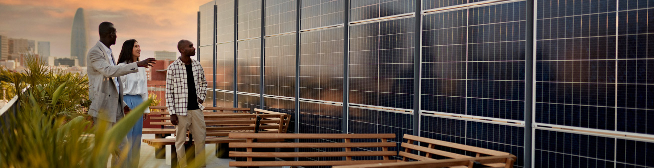 Image of people looking at solar panels.