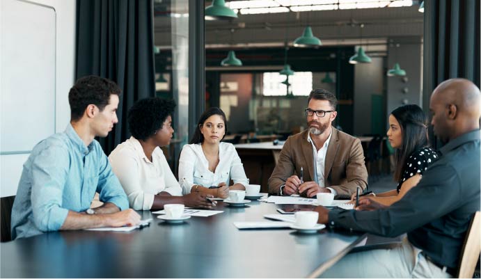 A group of people talking at a table