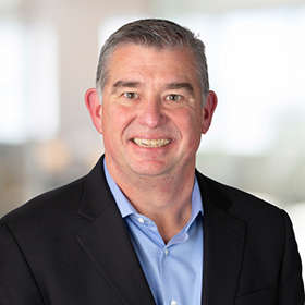 Professional headshot of Tom Patterson