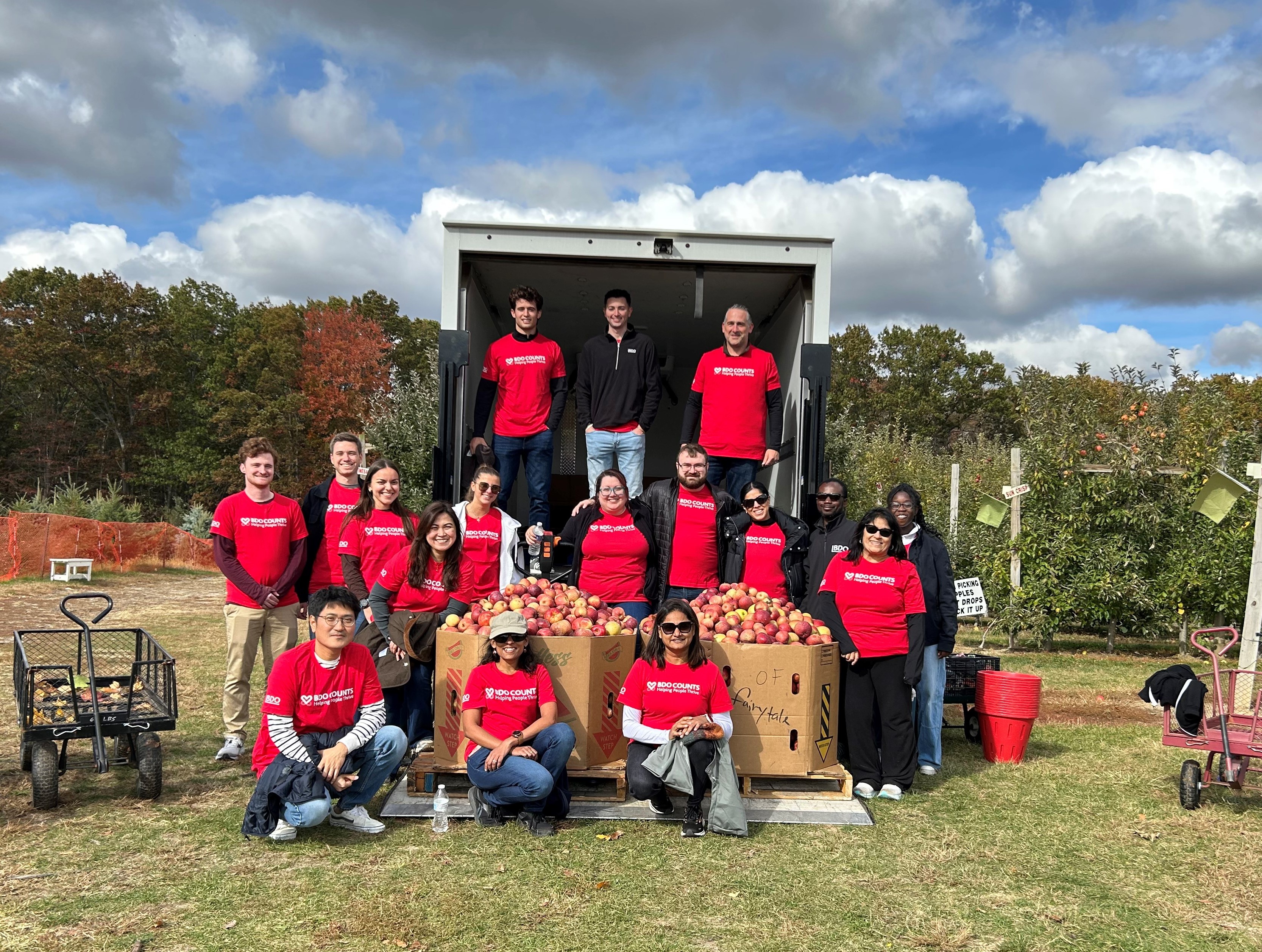 Three BDO team members doing community service