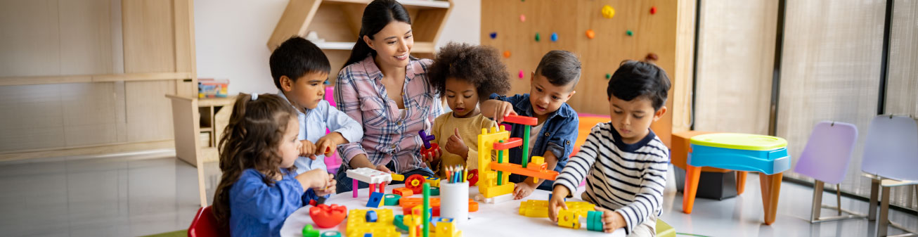 Children and teacher building in a classroom