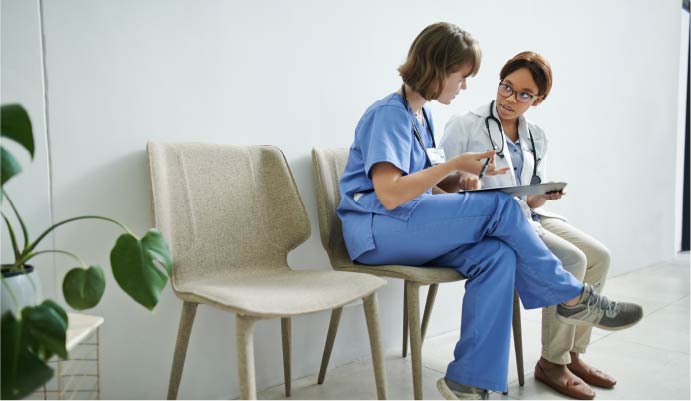 Doctor and nurse talking.