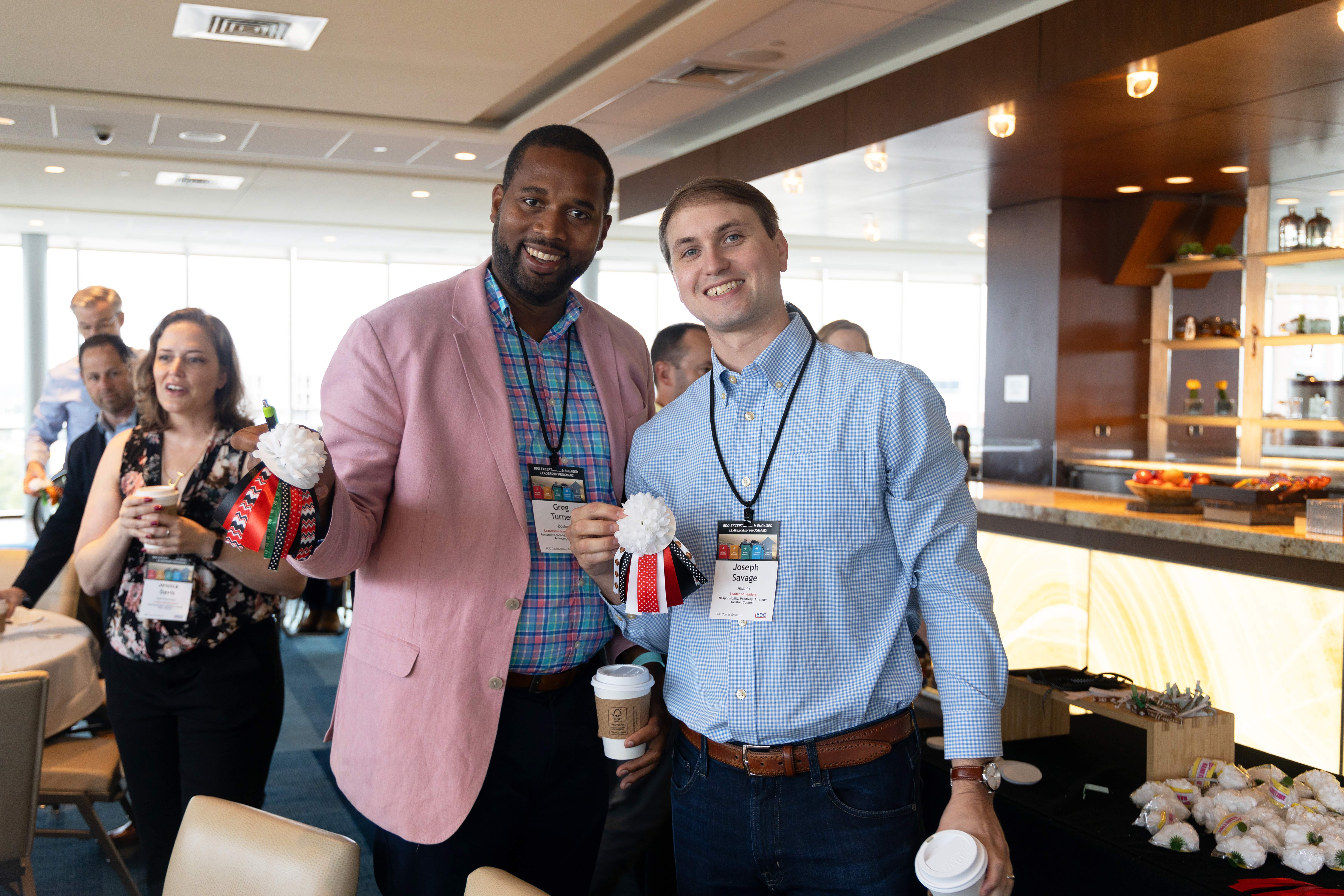 A photo of Turner and a colleague volunteer for Big Brothers Big Sisters of America.