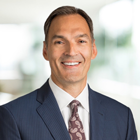 Professional headshot of Tony Huckeby