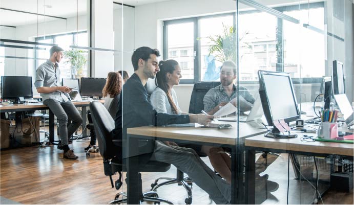 People in an office with computers