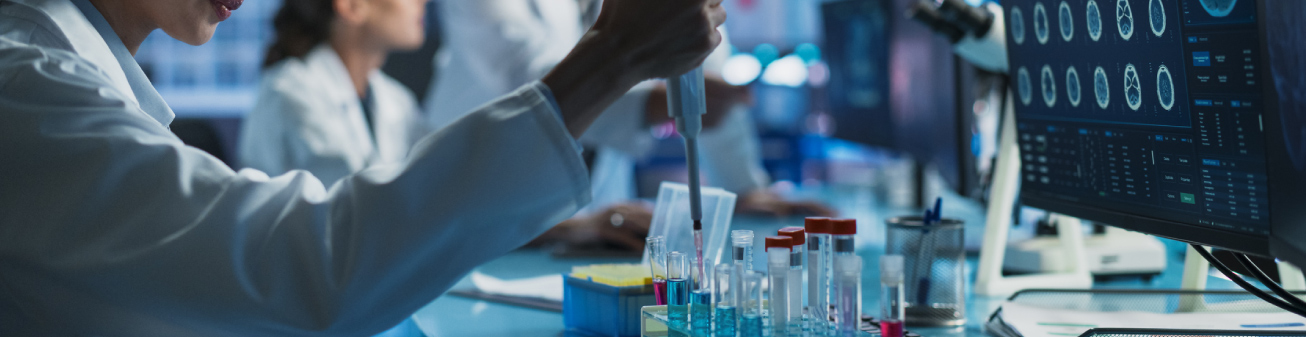 Lab employees with test tube