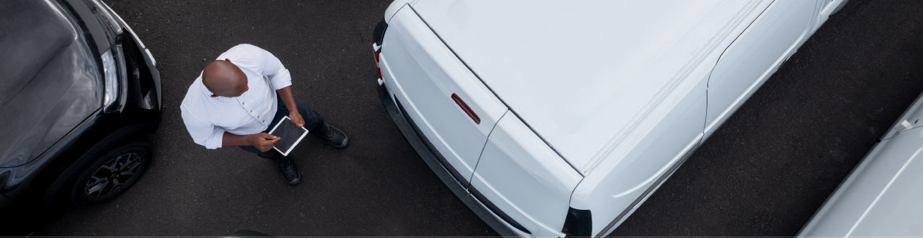 Image of person in a parking lot.