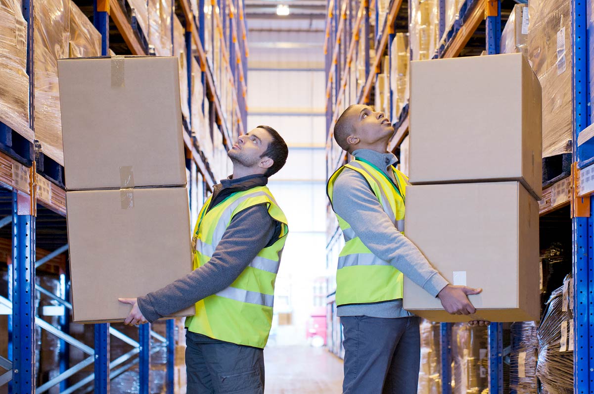 Two people holding boxes