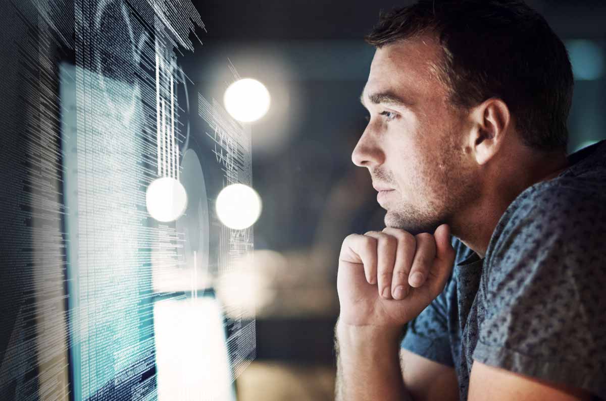 Man staring at a computer screen.