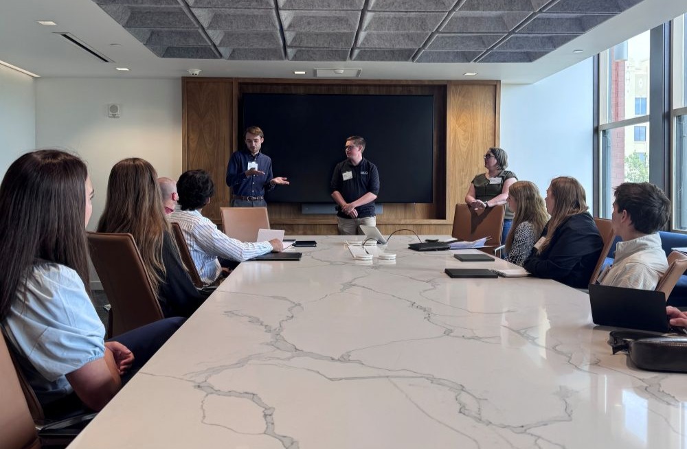 BDO Interns sitting at a conference table