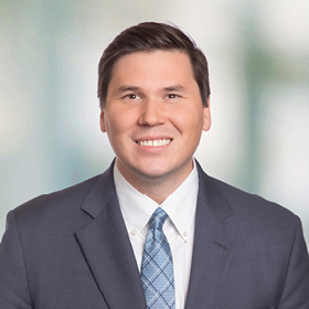 Professional headshot of Matthew Coker