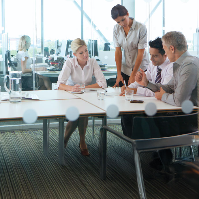 Four people working at a table