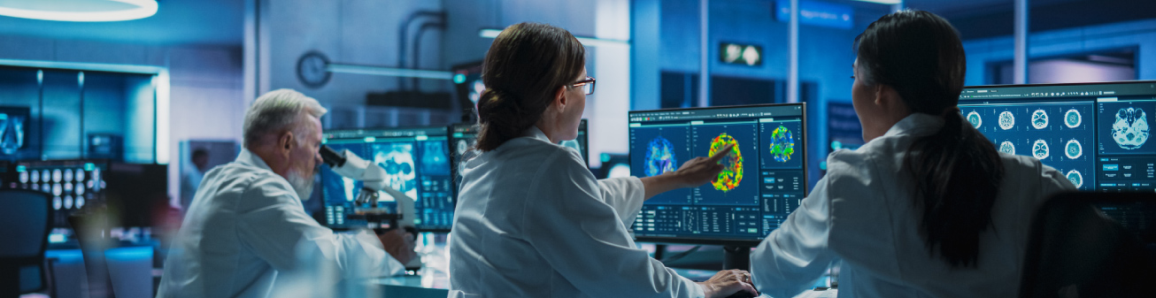 Lab employees assessing results