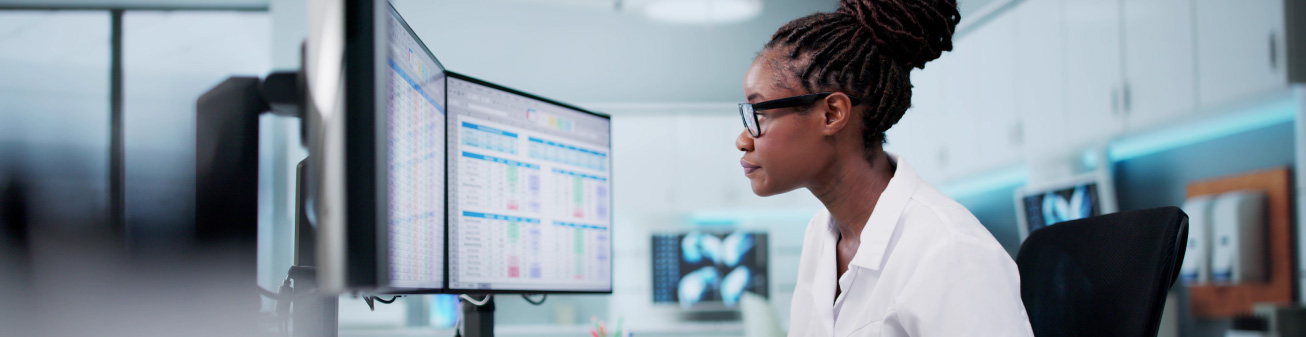 Healthcare employee looking at their computer