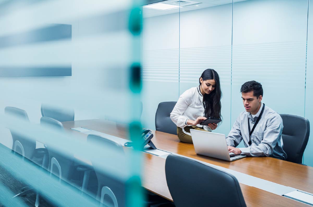 BDO Employees working in a conference room