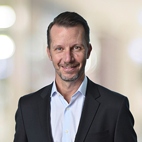Professional headshot of Kevin Adams