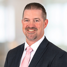 Professional headshot of Ryan Currie