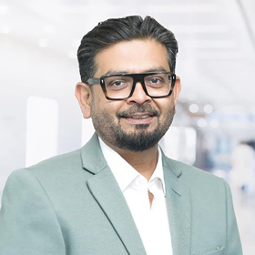 Professional headshot of Jiger Saiya