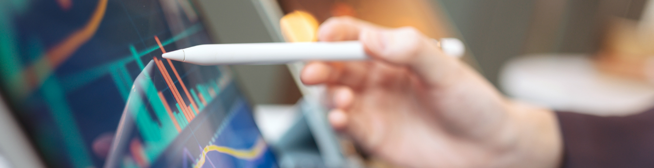 A person using a digital pen to read a graph