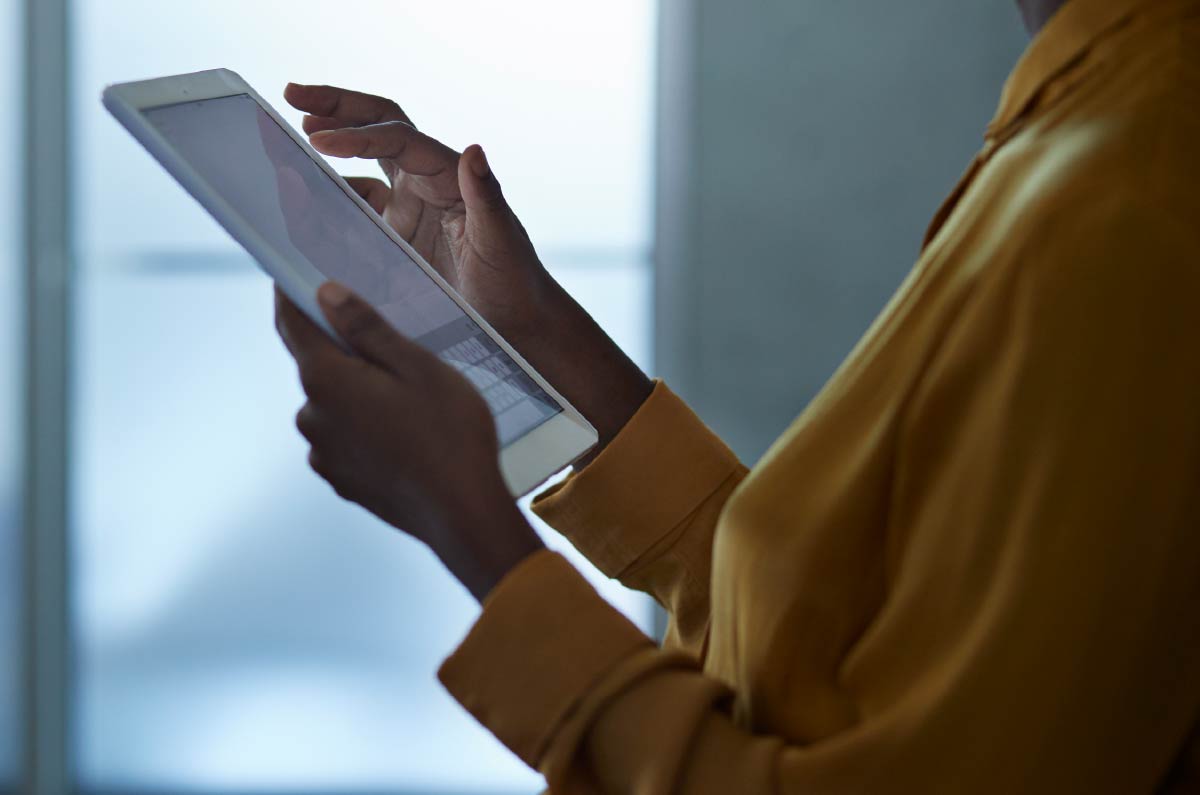 person reviewing checklist on tablet device