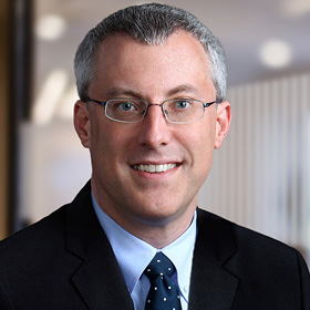 Professional headshot of Doug Bekker